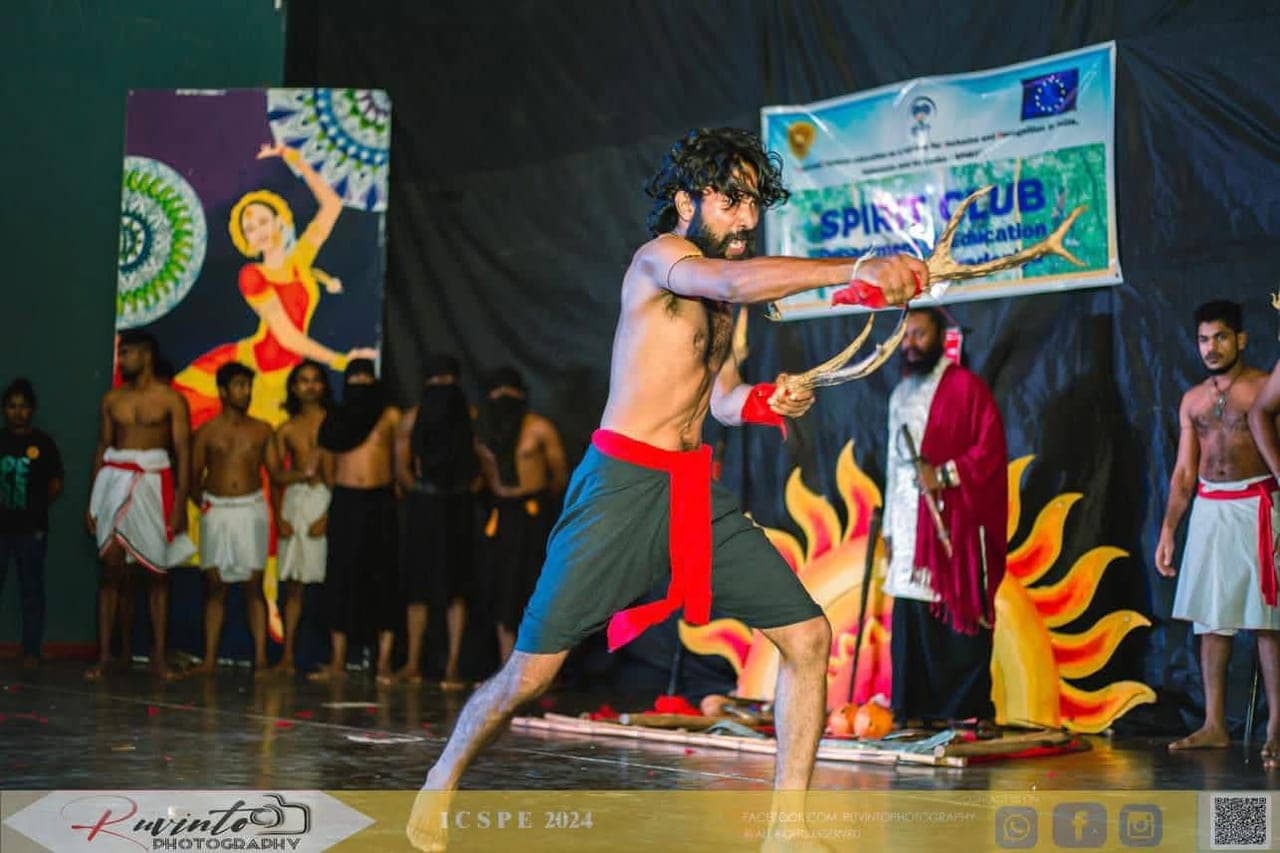 Kushan Neranjana performing an Angampora demonstration on stage