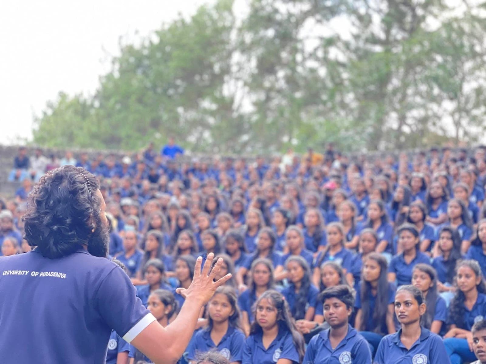 Kushan Neranjana speaking to hundreds of students at a history seminar